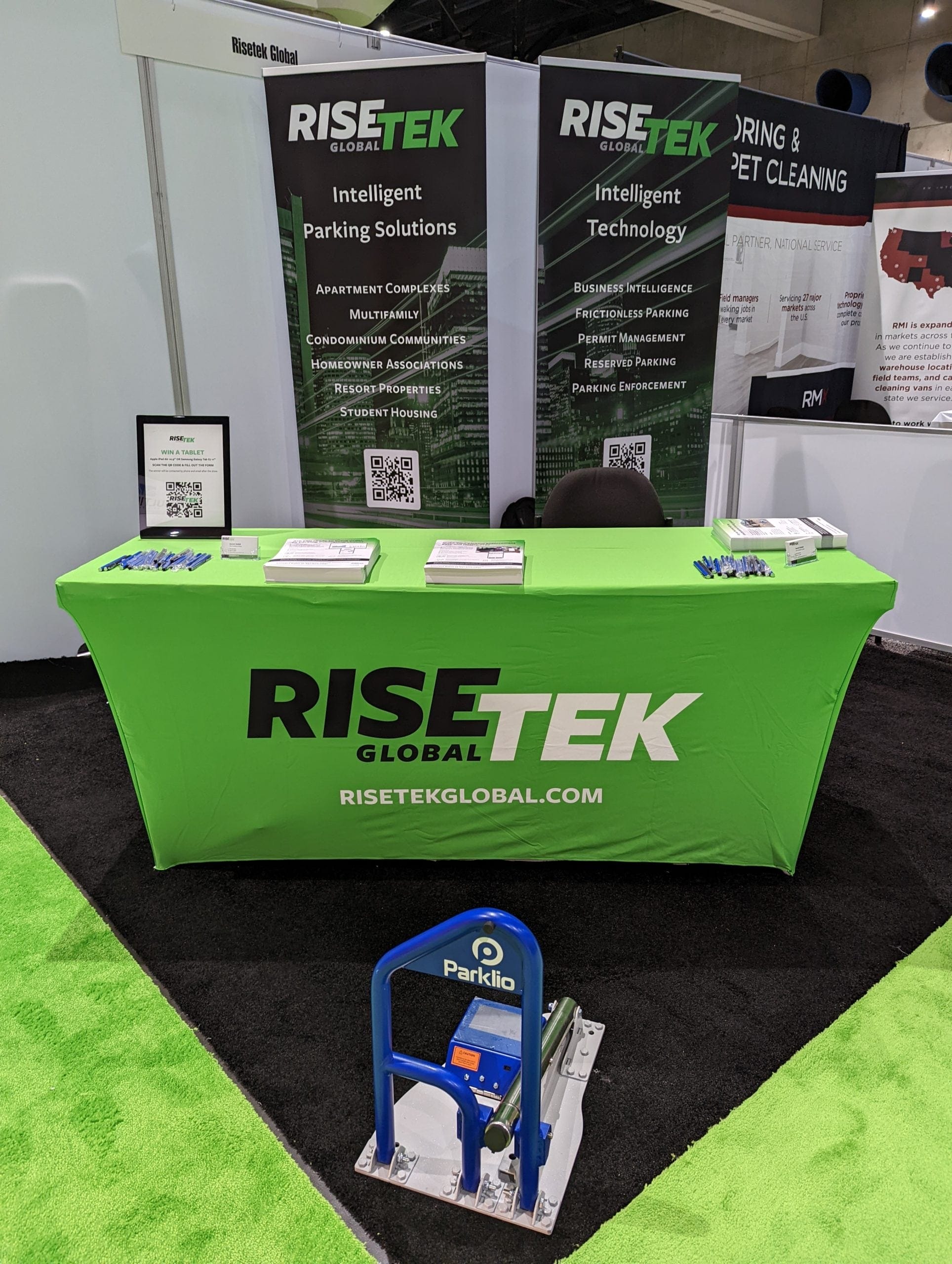 At the NAA Apartmentalize Expo, a trade show booth features a green 